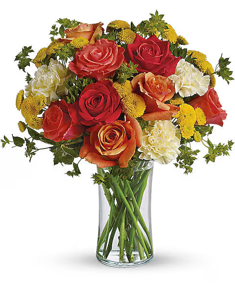 Red, orange, and yellow flower bunch in clear vase