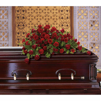 Red roses on a wooden casket with a decorative background