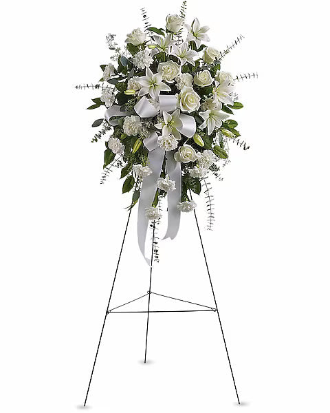 Elegant white flower bouquet with greenery on stand