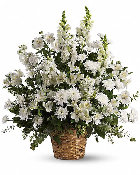 Elegant floral bouquet of white flowers in woven basket
