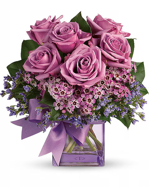 Bouquet of pink roses with a purple ribbon