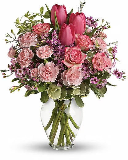 Bouquet of pink flowers clear vase 