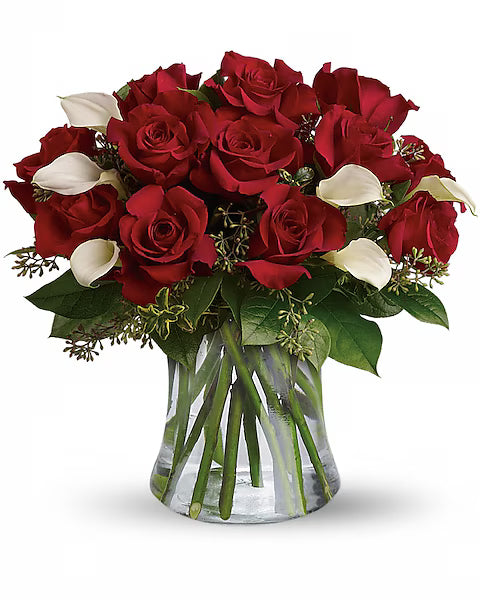Bouquet of red roses and white calla lilies